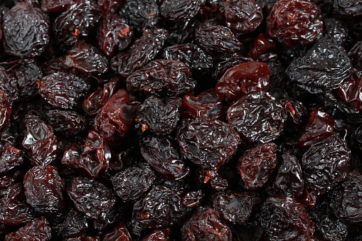 isolate of raisin in a wooden bowl
