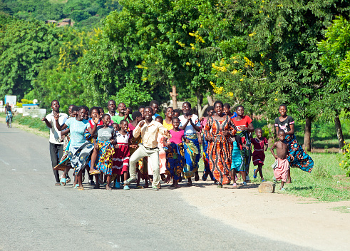Roadside religious celebration, near Lilongwe, Malawi, Africa. Malawi, the landlocked country in southeastern Africa, is a country of highlands split by the Great Rift Valley and the huge Lake Malawi, whose southern end is within Lake Malawi National Park and several other parks are now habitat for diverse wildlife from colorful fish to the Big Five. Cape Maclear is known for its beach resorts, whilst several islands offer rest and recreation.