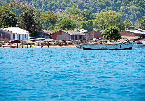 Shoreline community, Masaka Fishing Village, Lake Malawi, Malawi, Africa.  Malawi, the landlocked country in southeastern Africa, is a country of highlands split by the Great Rift Valley and the huge Lake Malawi, whose southern end is within Lake Malawi National Park and several other parks are now habitat for diverse wildlife from colorful fish to the Big Five. Cape Maclear is known for its beach resorts, whilst several islands offer rest and recreation.