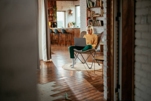 istock Young woman working on laptop at home. 1489506439