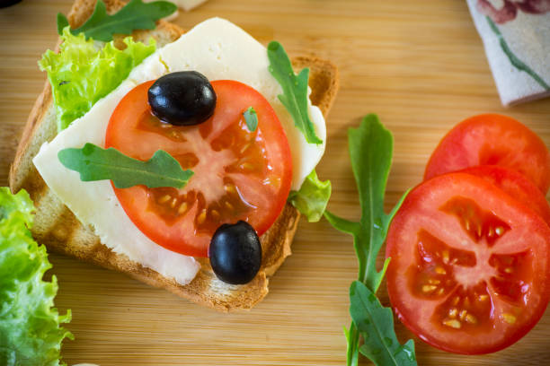 istock fried toasts with mozzarella, lettuce and tomatoes with herbs 1489507497