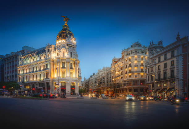Calle de Alcala and Gran Via Streets at night with Edificio Metropolis Building - Madrid, Spain stock photo