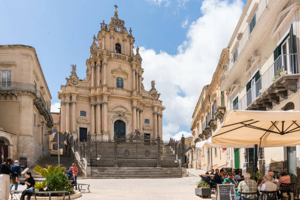 Ragusa Ragusa, Italy-May 8, 2022:View of the cathedral of San Giorgio in the cathedral square during a sunny day san giorgio maggiore stock pictures, royalty-free photos & images