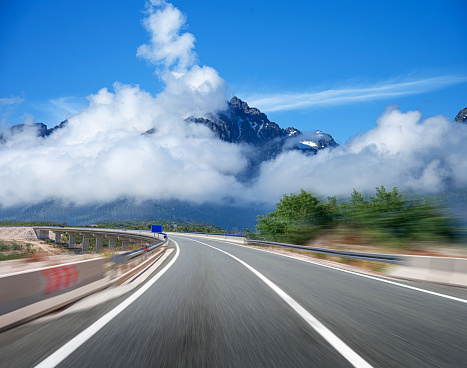 Asphalt road to mountain. Traveling concept. Picturesque road in the mountains.