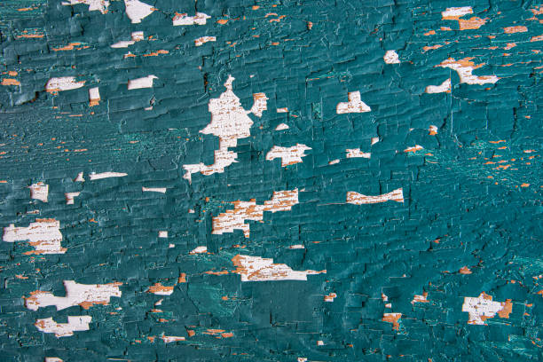 Texture of old paint on a wooden background.