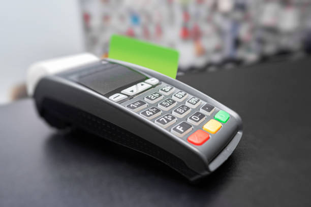 istock Bank terminal and payment card. 1489514831