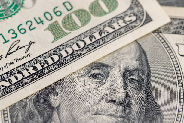 istock several American hundred dollar bills close-up 1489515214