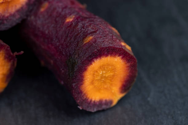 Sliced purple-orange carrots on the table