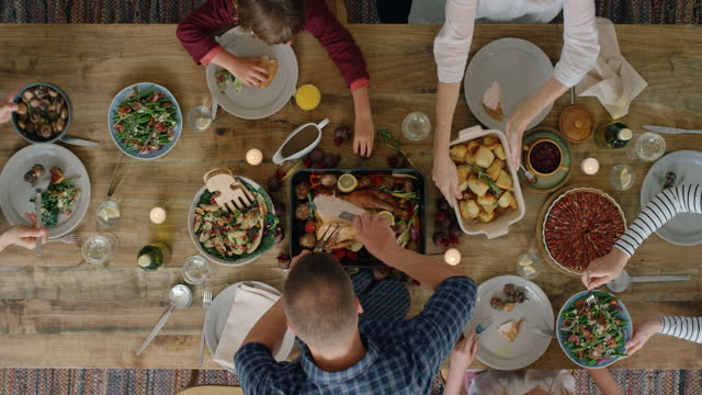 happy family eating thanksgiving meal together enjoying tasty homemade lunch holiday celebration feast top view