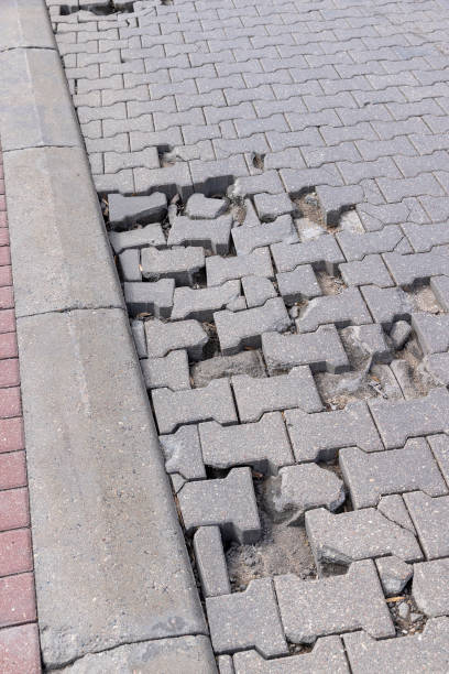 istock damaged and broken concrete tile road, close-up 1489517131