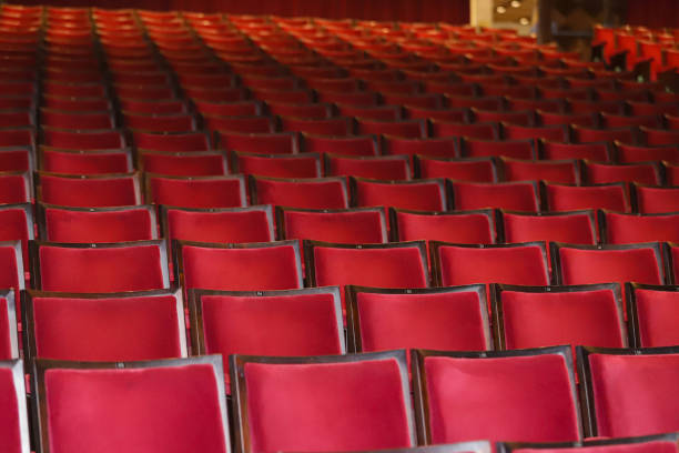 Empty vintage seat in auditorium or theate. Academic gathering, empty old armchairs in a row.