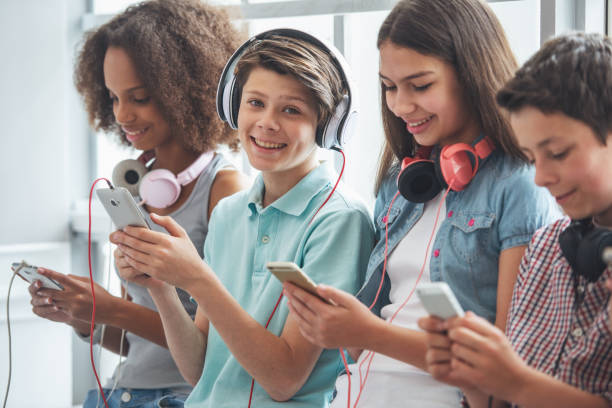 Teenagers with gadgets stock photo