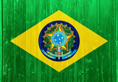 Flag of the Brazil on a textured background. Concept collage.