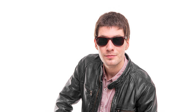 Attractive man in dark sunglasses isolated on white background.