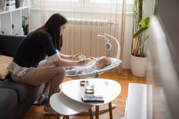 istock Mother feeding baby porridge 1489523400