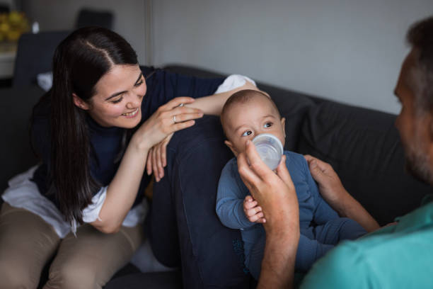istock Baby being fed formula milk by its parents 1489523773