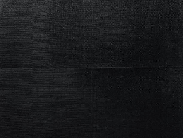 istock digital macro photo of folded paper with dark printer ink on it, 1489524973