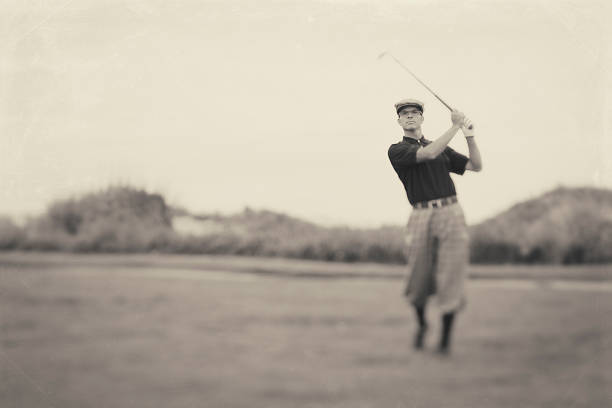Vintage Golf A male golfer in knickers goes for the green. Vintage processing. golf photos stock pictures, royalty-free photos & images