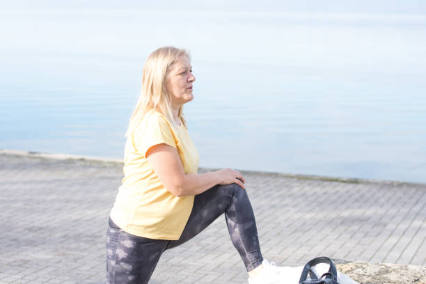 istock Mature woman stretching 1489531332