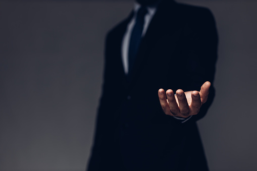 Businessman with empty hand. Business hand a palm up gesture on a background. Businessman showing empty hand and presenting with hand empty