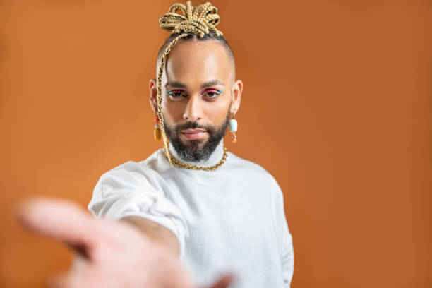 istock Black latin gay man outstretching empty hand towards camera 1489532159