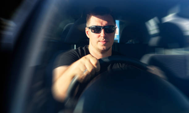 istock The man is driving a car. 1489535655