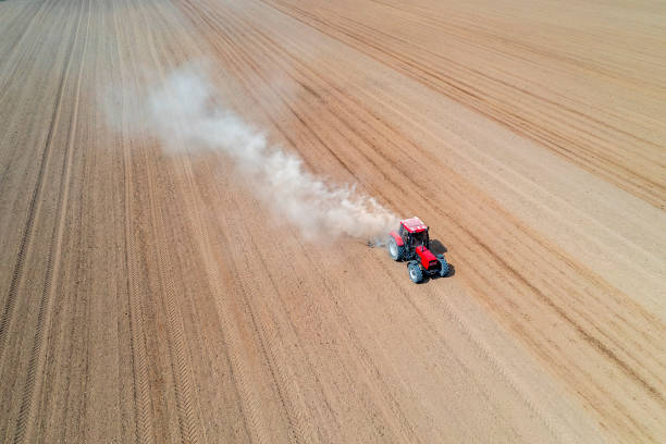 istock Aerial view of a tractor plows a field 1489536266