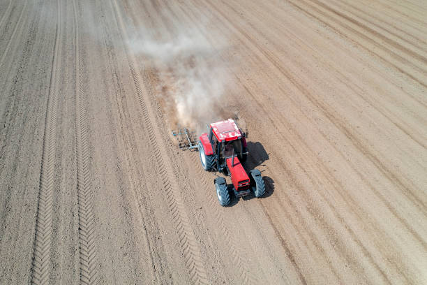 istock Aerial view of a tractor plows a field 1489538679