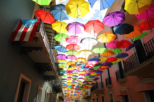 Colorful umbrellas hang from a famous street in San Juan, Puerto Rico.