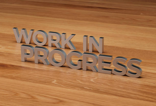 istock WORK IN PROGRESS 3D rendered in metal on wood desk background 1489538730