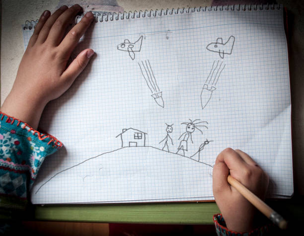 Close up girl drawing dinosaur on paper at home