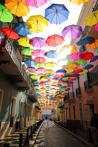 Colorful umbrellas hang from a famous street in San Juan, Puerto Rico.