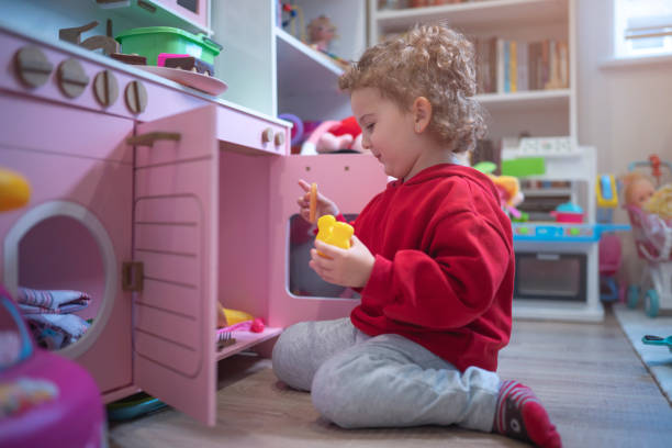 girl playing with toys stock photo