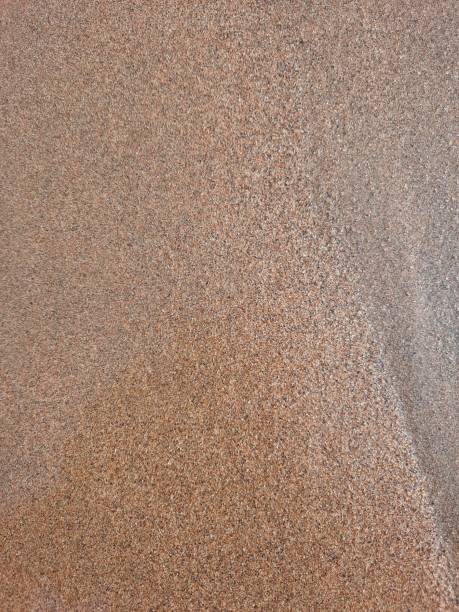 istock Closeup of beach sand pattern in summer 1489549972