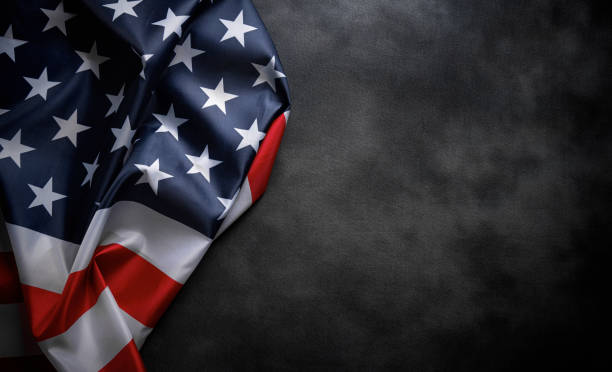 istock USA American flag on worn darck background. 1489553505
