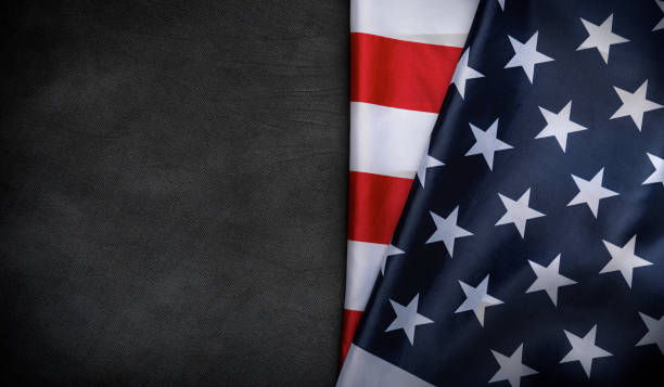 istock USA American flag on worn darck background. 1489553511
