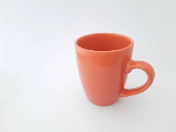 istock Mug on white background, orange mug, cup, orange cup 1489553739