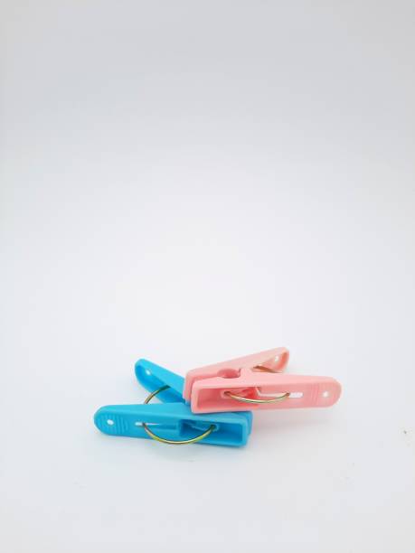 istock blue and pink clothes pin isolated on white background 1489554987