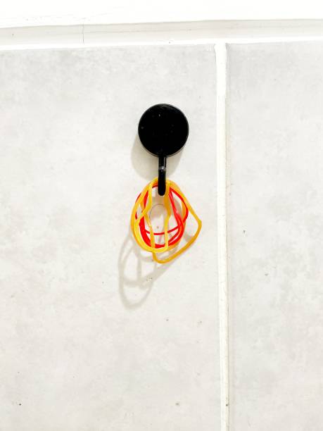 istock rubber bands hanging on the wall 1489555289