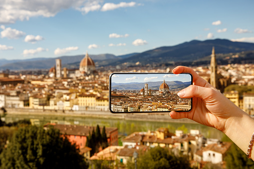 Travel photography: Taking photos via cellphone. Florence, Italy