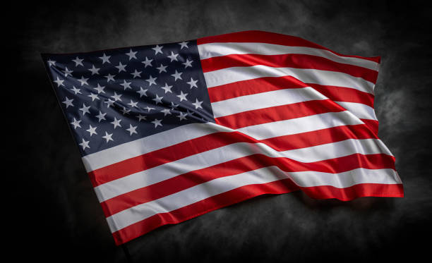 istock American flag on dark background 1489557203