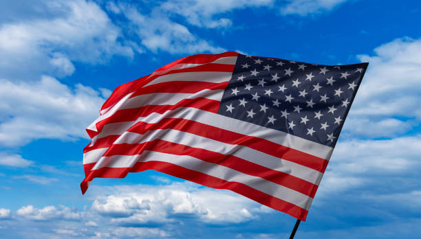 istock American flag on the blue sky 1489557239