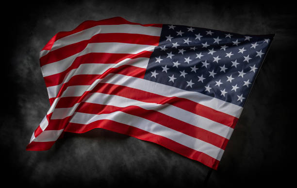 istock American flag on dark background 1489557248