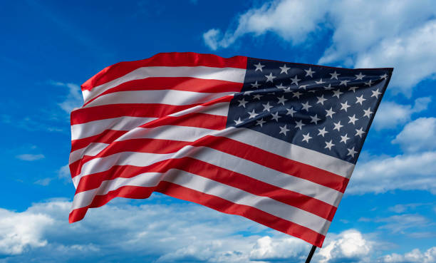 istock American flag on the blue sky 1489557254