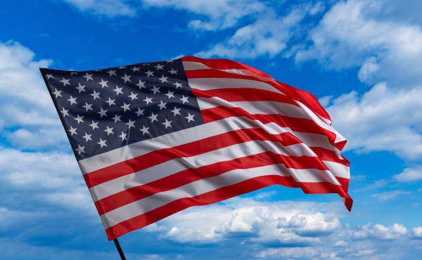 istock American flag on the blue sky 1489557256