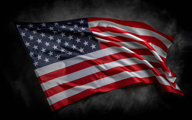 istock American flag on dark background 1489557272
