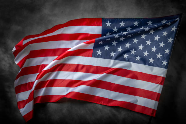 istock American flag on dark background 1489557278