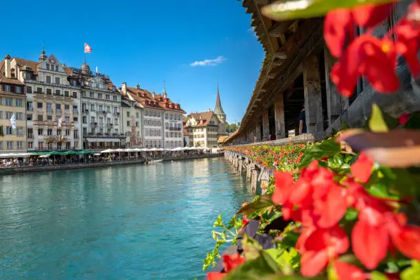 View from the Chapel Bridge in historic city of Lucerne,  Switzerland.  One of the main tourist attractions in the city center.
