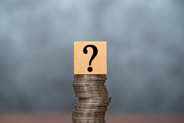 istock Question mark with coins stack on the gray background. Money offer concept. Mock up for different business ideas. Empty place for a text. 1489564268