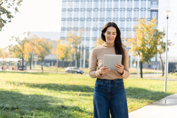 istock Happy woman enjoying after work and using tablet 1489567197